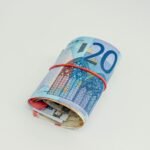 International currency spread on a table representing NRE repatriation from India by an NRI