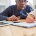 Senior man reviewing paperwork for retirement planning