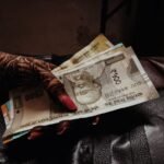 Indian rupee notes representing savings under NRI PPF account rules